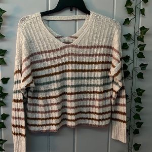 White sweater with colorful stripes